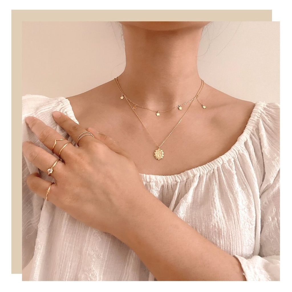 What is Boho Style Female with gold dainty jewellery 