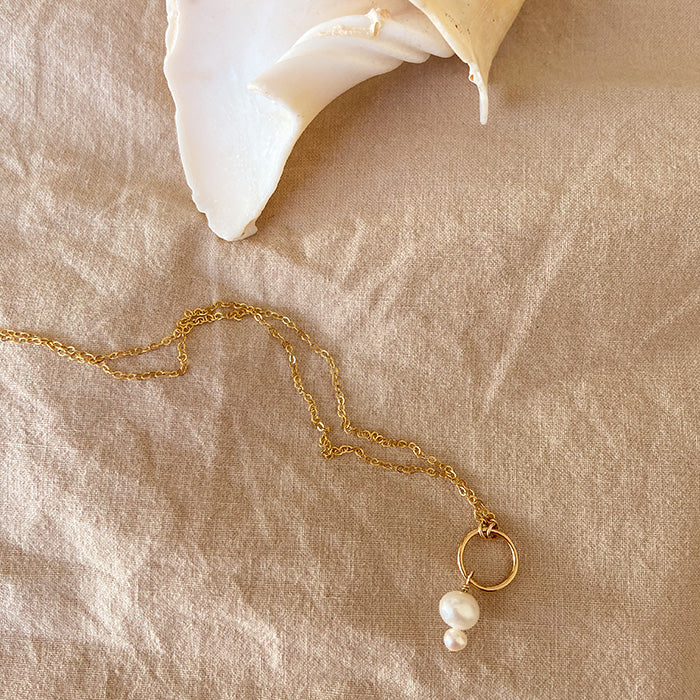 pearl necklace on gold chain