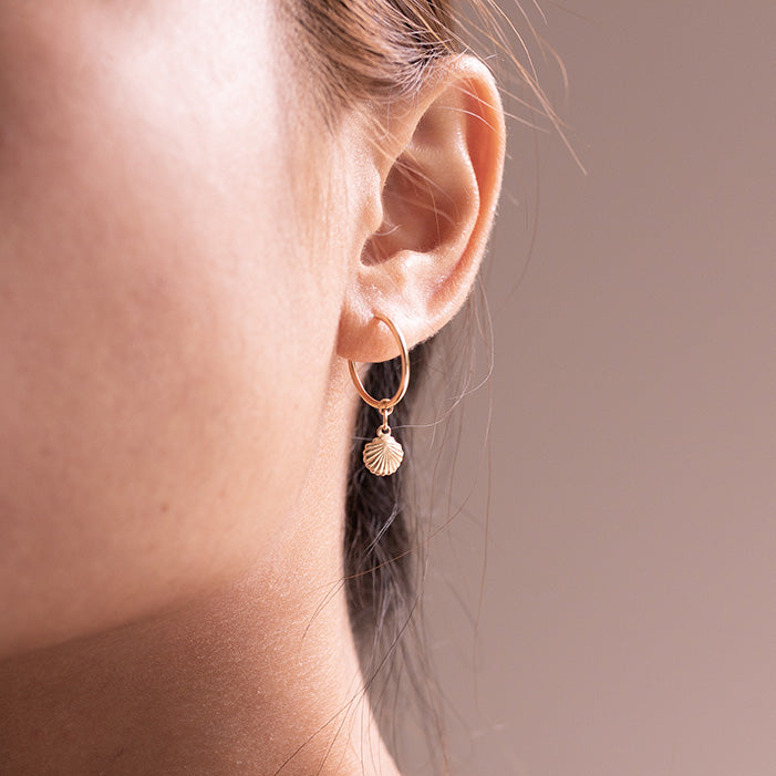 Seashell Hoop Earrings on female ear