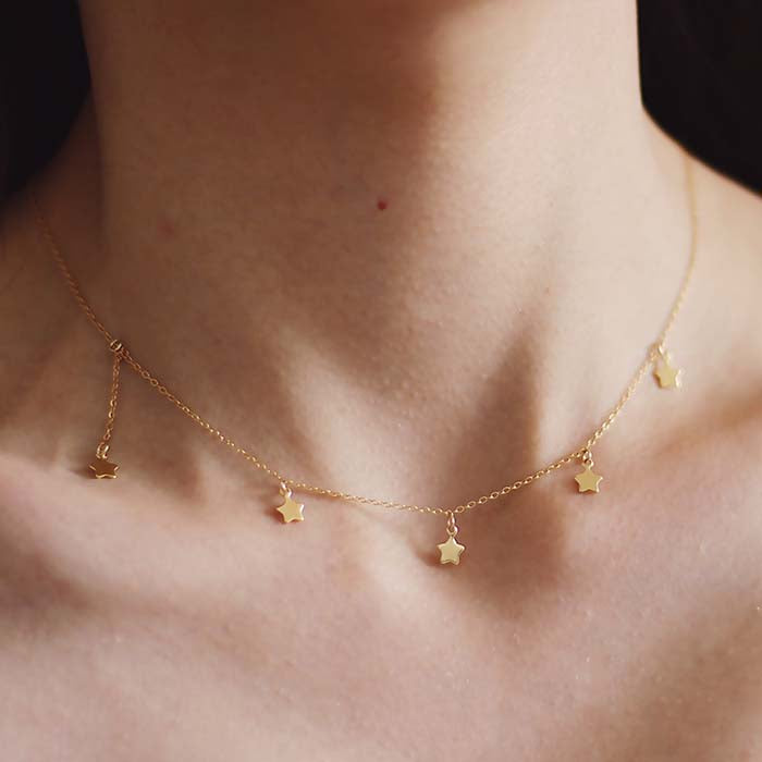 Stellar Necklace star necklace gold chain boho lifestyle with model