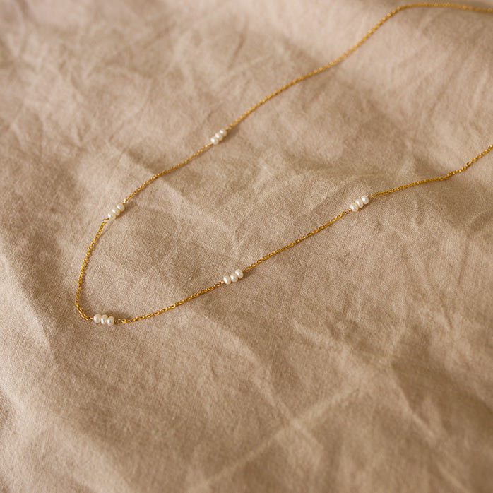 pearl necklace on a gold dainty chain