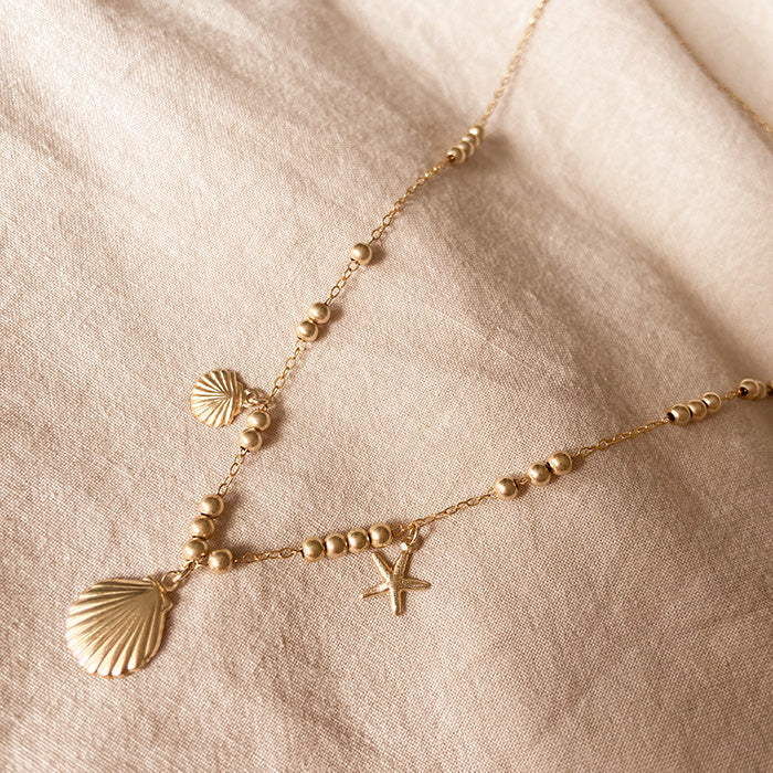 seashell treasure gold necklace